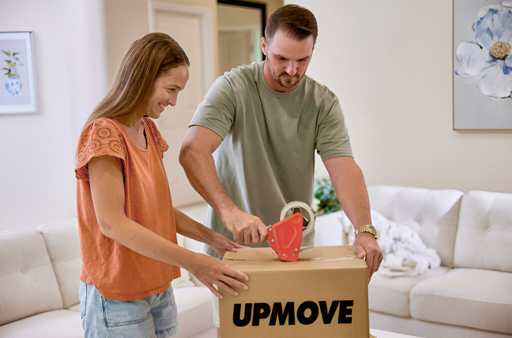 Guide to moving in Canberra – couple packing boxes.